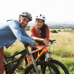 Young Couple Cycling In Countryside