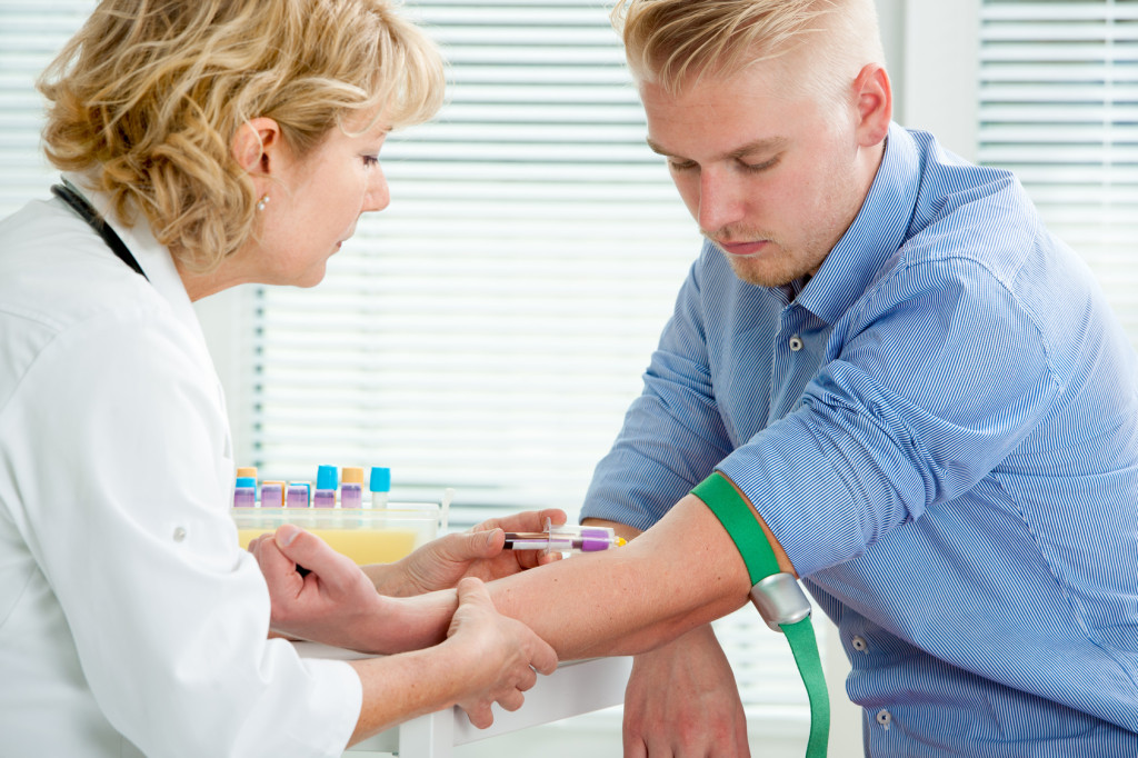 Nurse taking blood sample