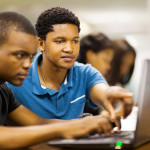 african college students using laptop
